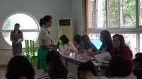 武汉市幼儿教师社会活动课优质课教学比赛《社合作力量大说评课》